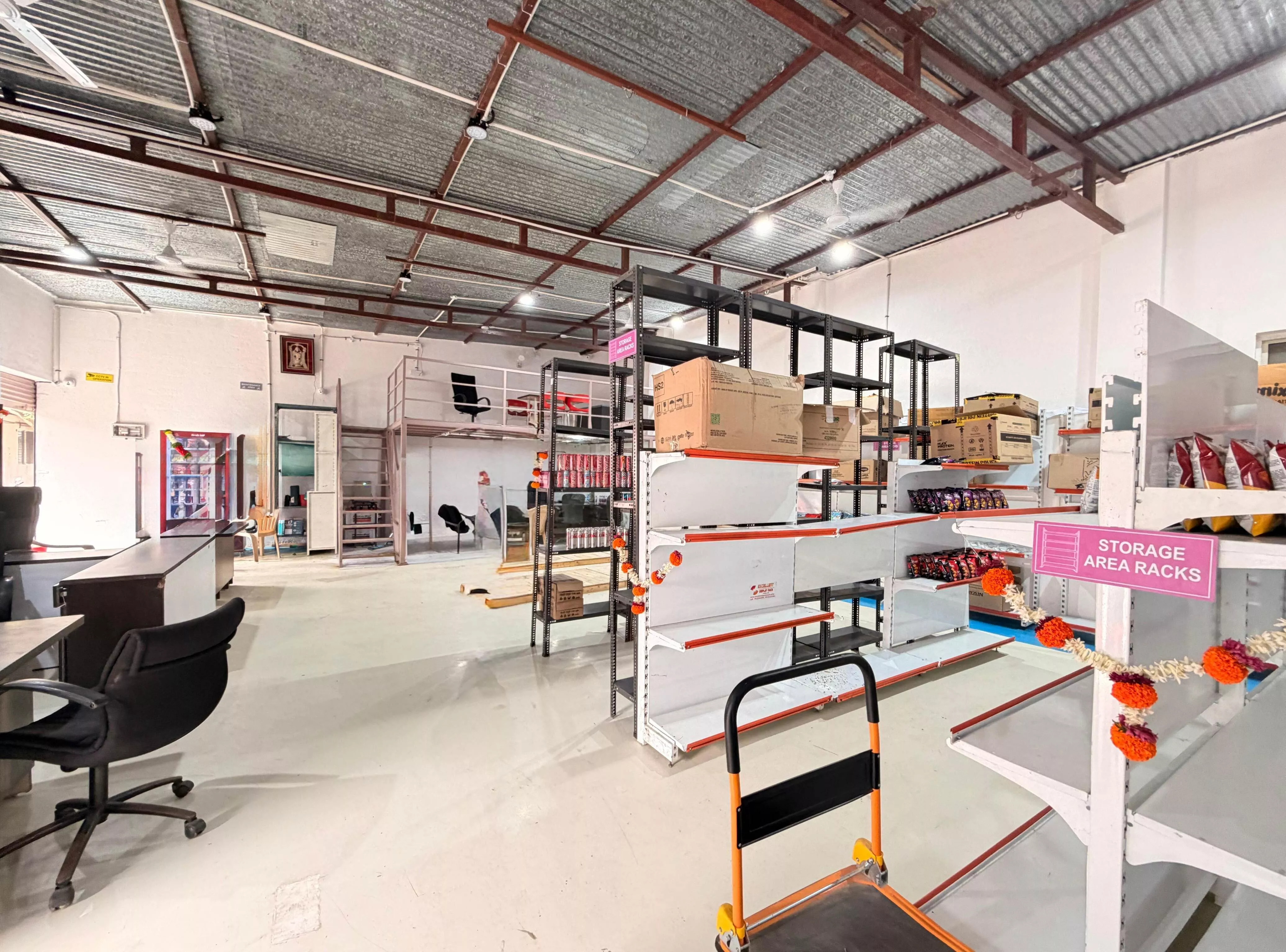 Storage area racks stocked with inventory at the SnapGo Bhugaon warehouse